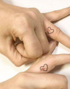 Couple finger tattoos
