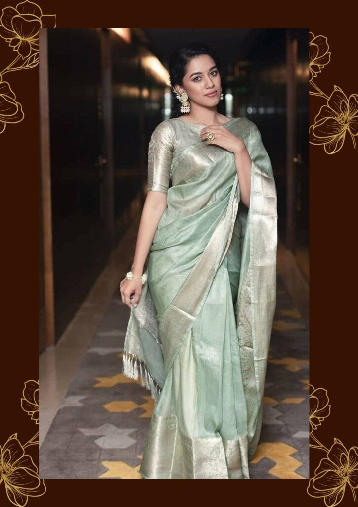 model wearing light coloured silk saree